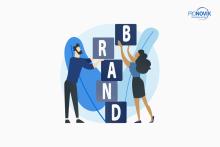 people building the word "brand" out of building blocks